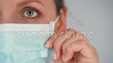 对Covid-19冠状病毒的大流行保护。 戴着医用面罩的白人女人。 病毒防护。